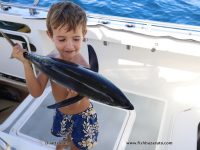 Little Duarte posing with one of the smallest Yellowfin Tuna we got for the day