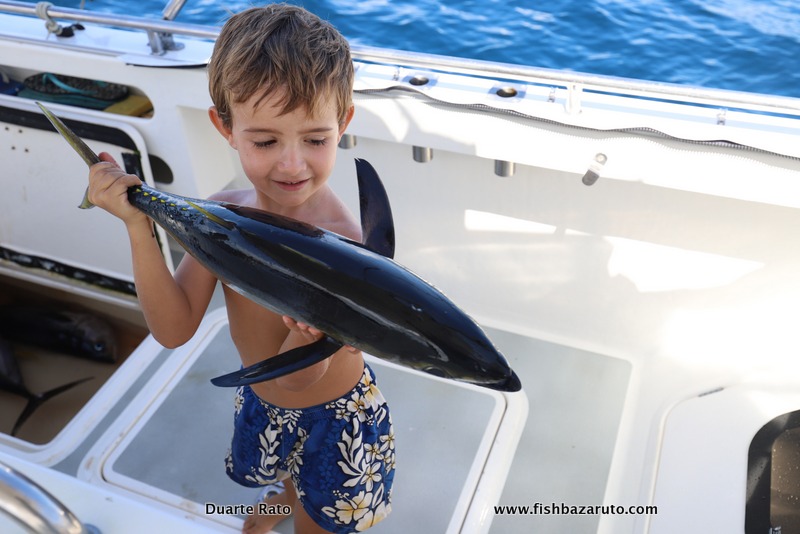 Little Duarte posing with one of the smallest Yellowfin Tuna we got for the day